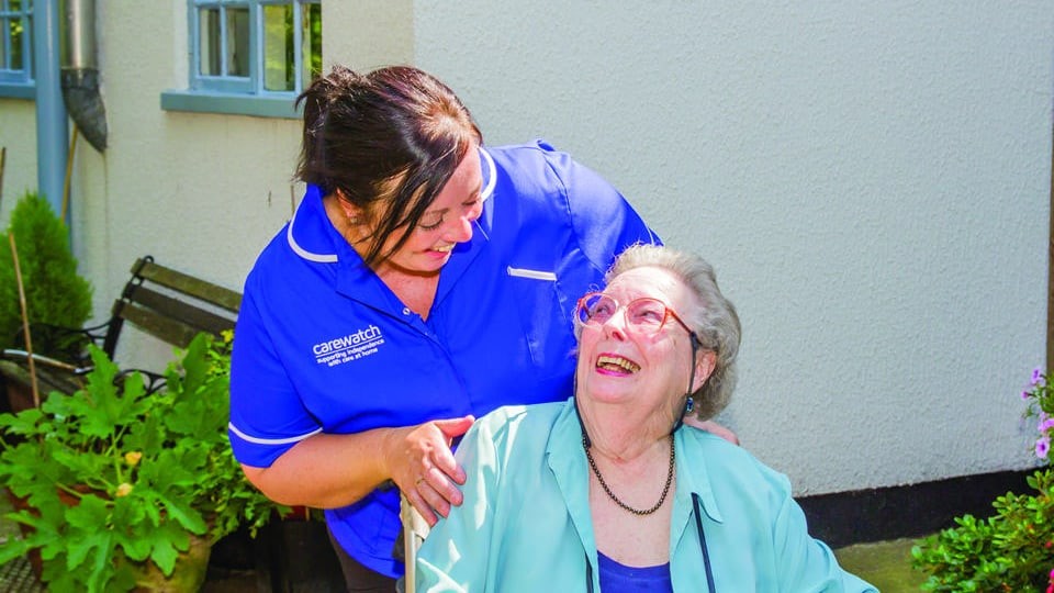 woman in wheelchair with caregiver