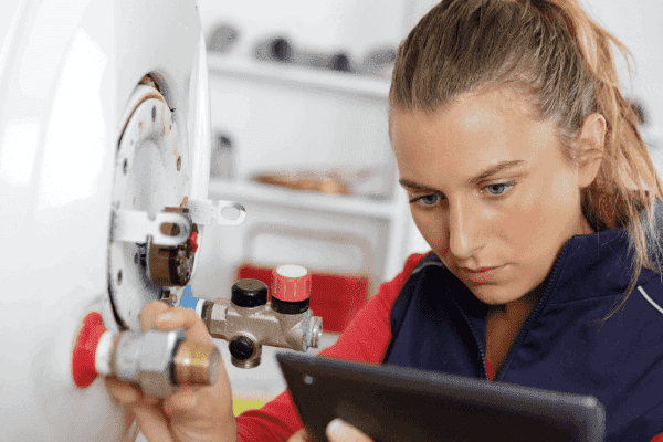 employee working on a boiler