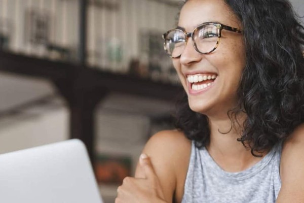 smiling woman at a computer