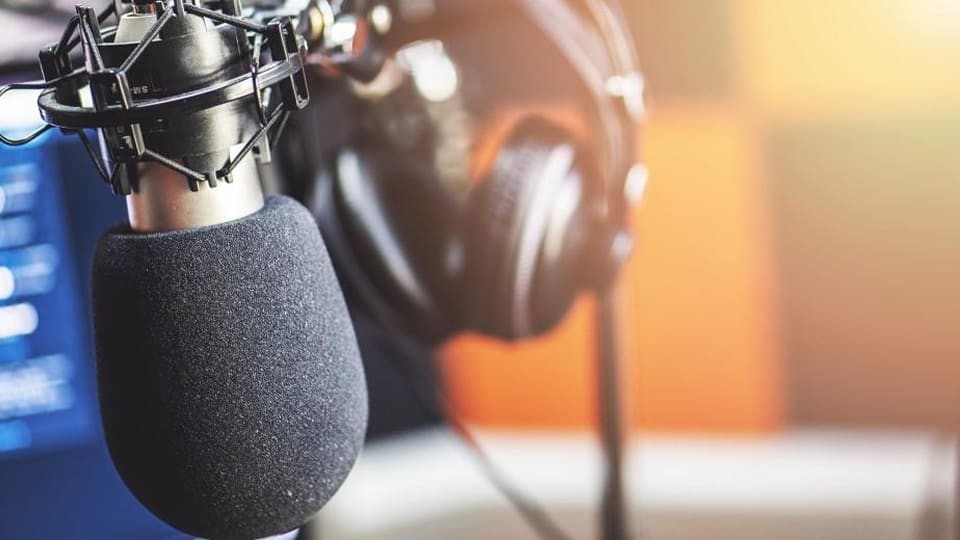 close up of studio microphone and headphones