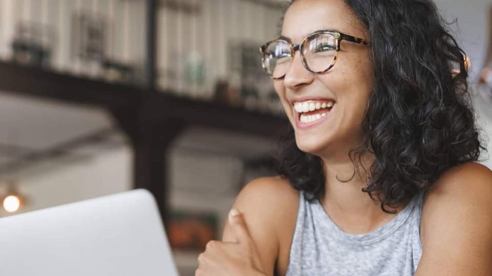 smiling woman at a computer