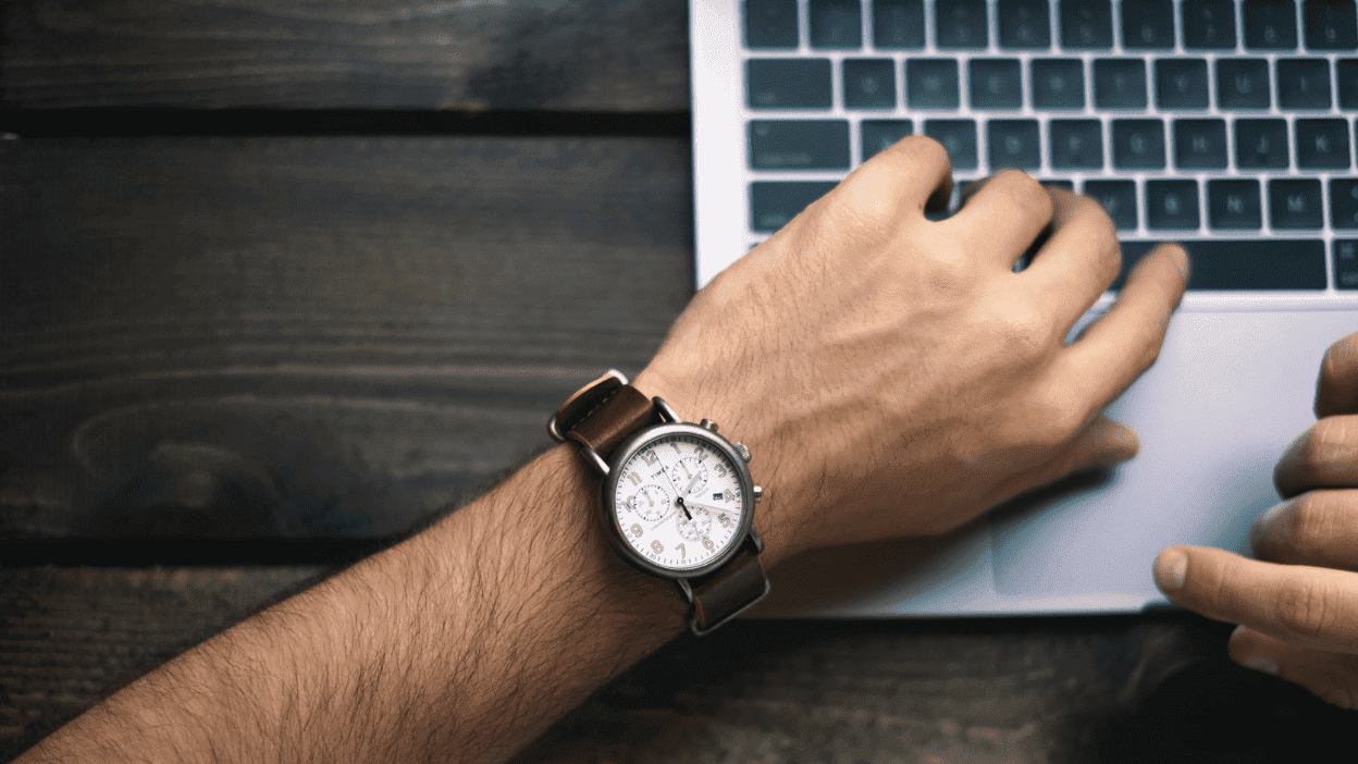 Man looking down at his watch