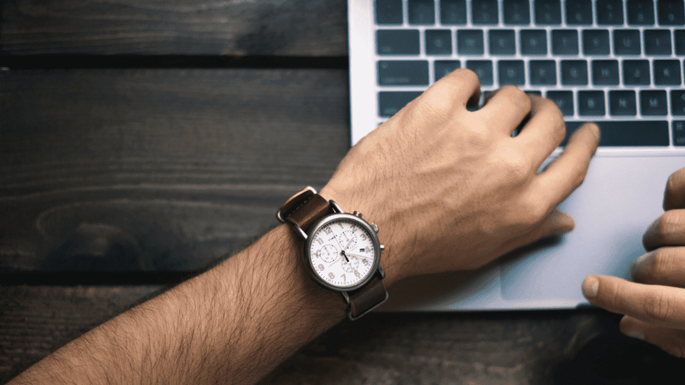 Man looking down at his watch