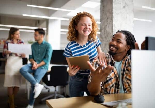 Business people chatting and having fun in the workplace office