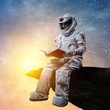 spaceman reading a blog article