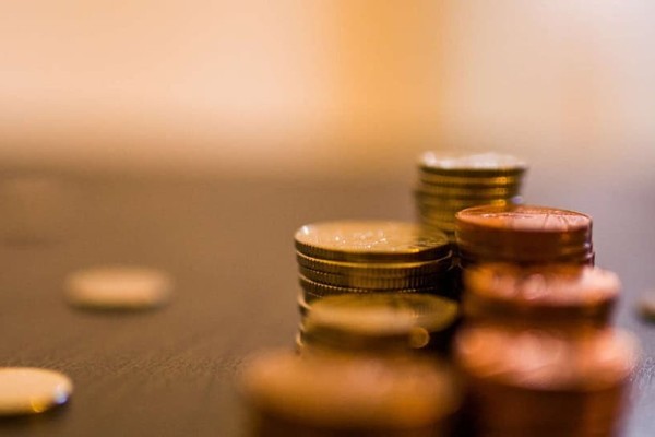 piles of coins on a table