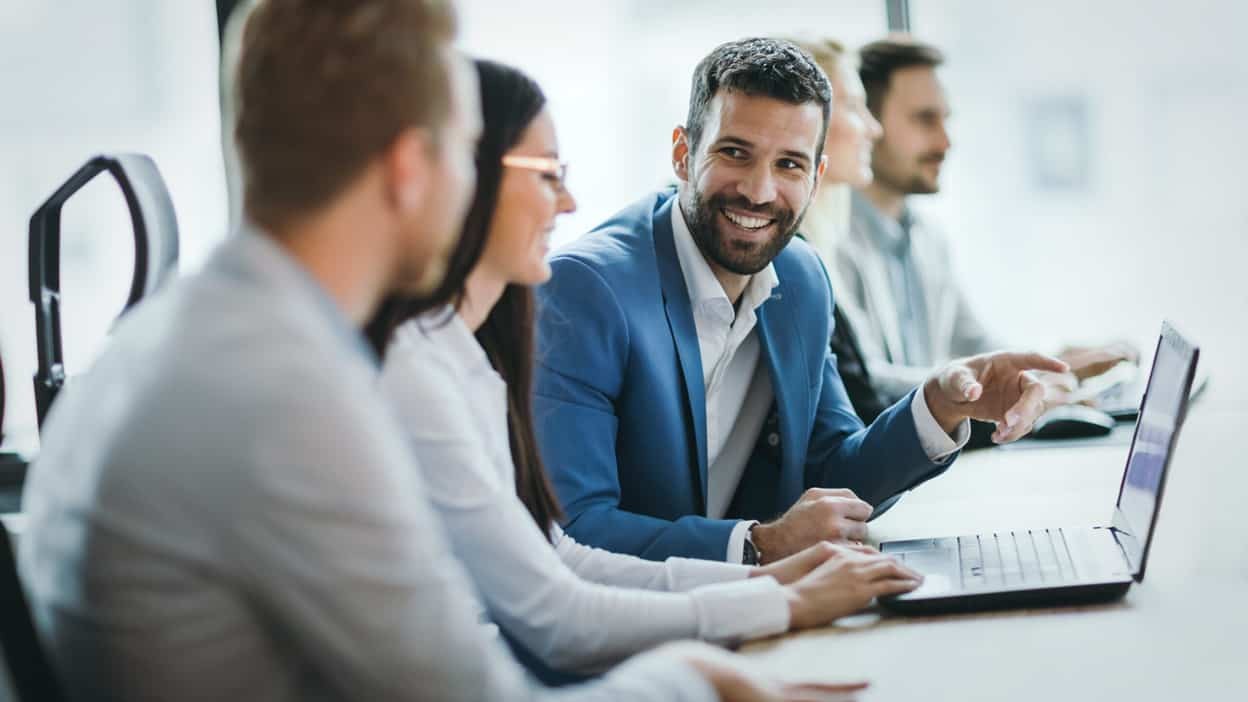 business meeting around a laptop