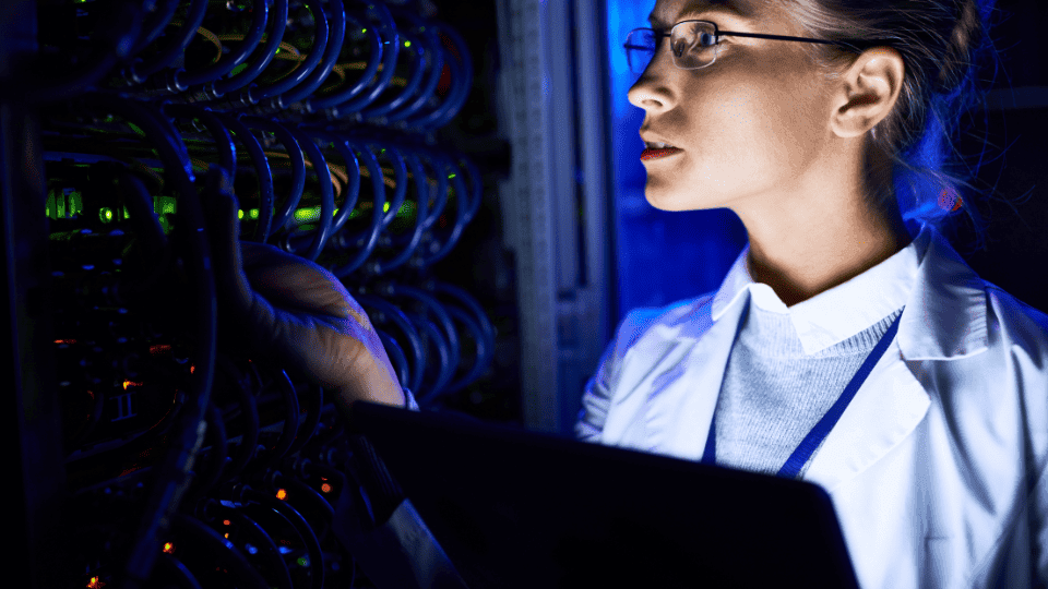 woman working on a mainframe