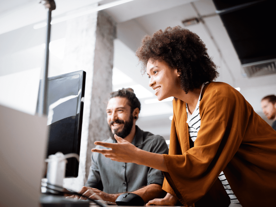 Man and woman at a computer