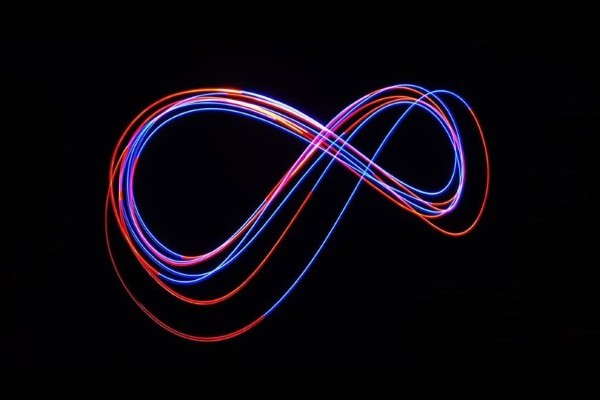 red and blue light in an infinity sign