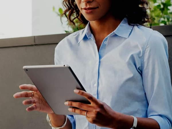 woman holding a tablet