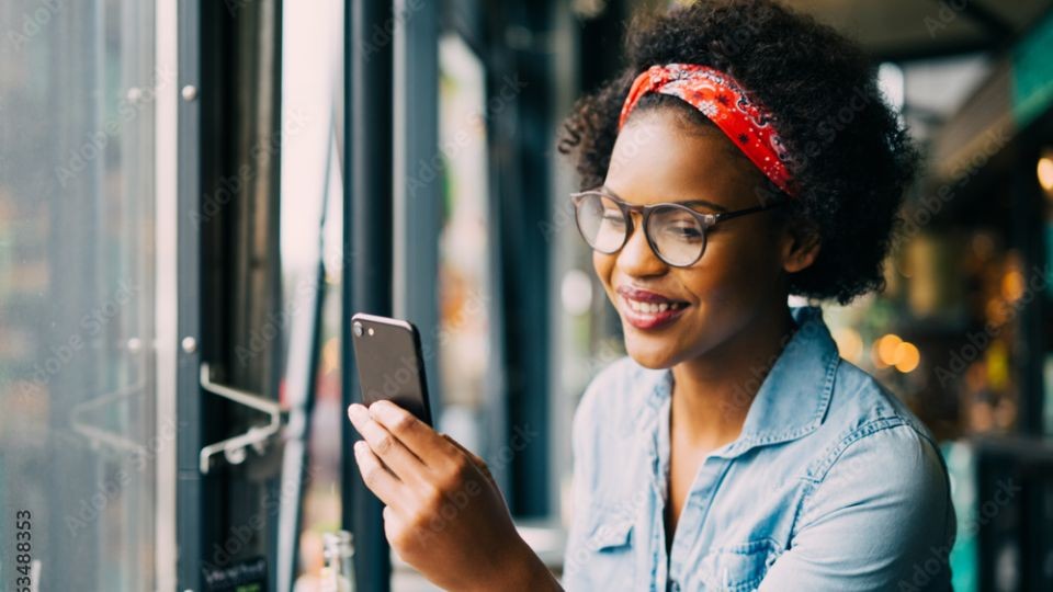 woman looking at mobile phone