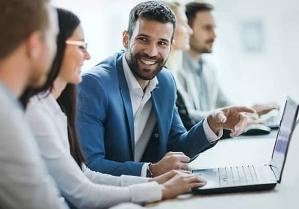 business meeting around a laptop