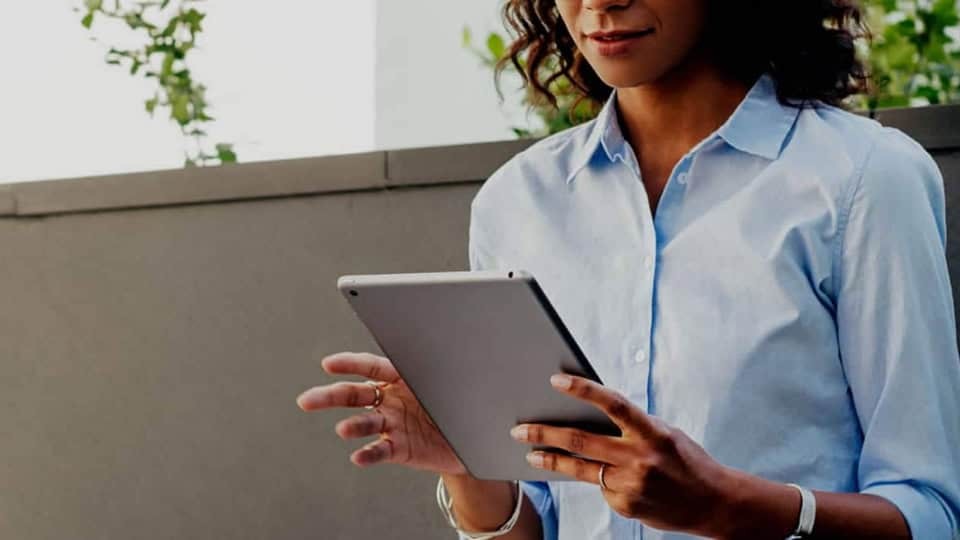 woman looking at a tablet computer